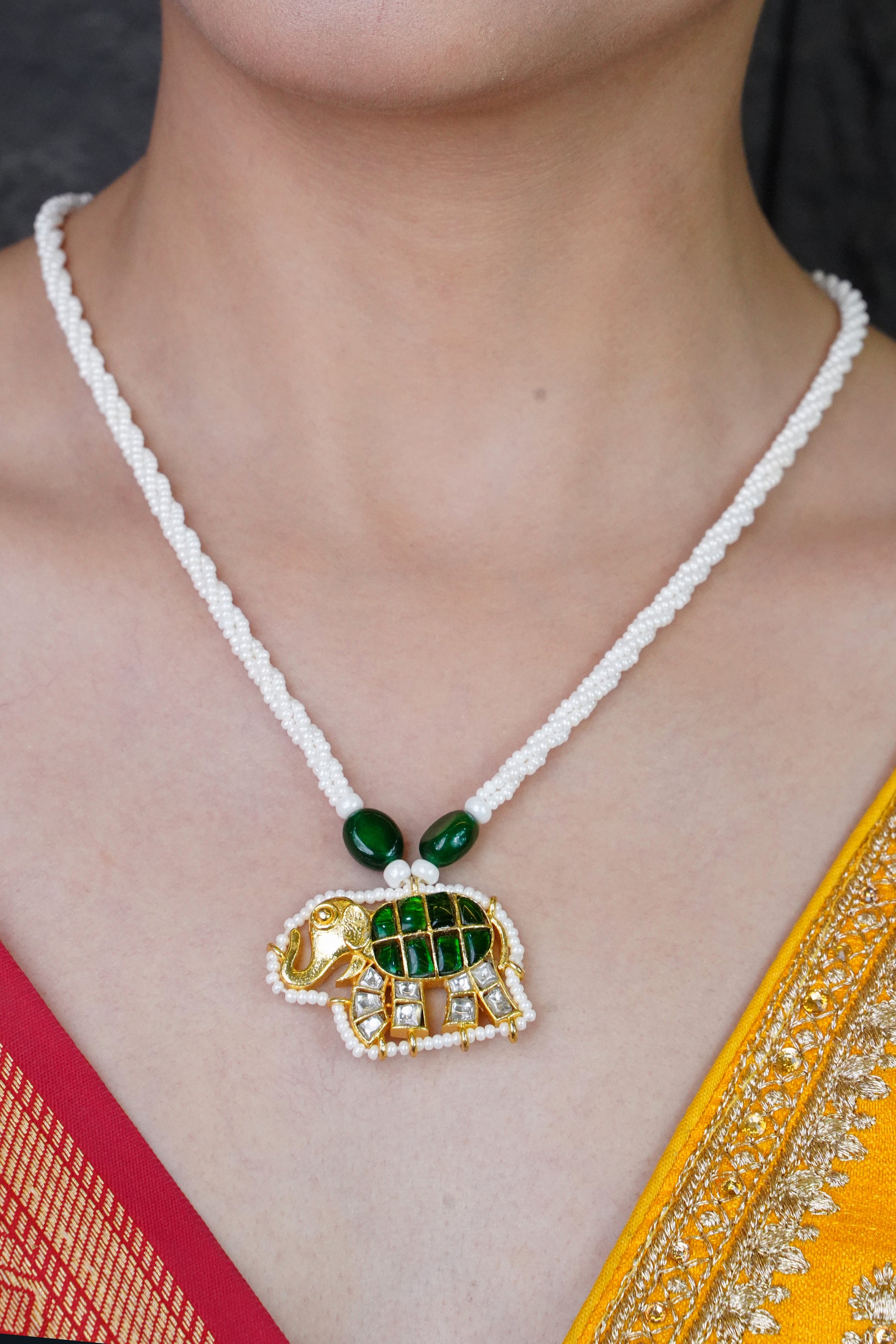 Rajsi Gajmukhta green kundan necklace with elephant pendant and ched pearls
