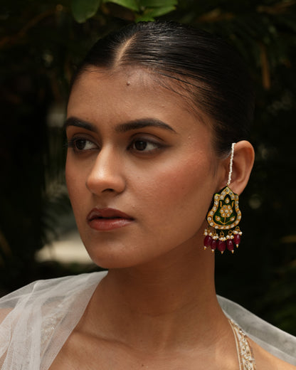 Close-up of emerald green Meenakari jadau earrings with kundan, pearls, jade and kaan chain – Indian handmade jewelry